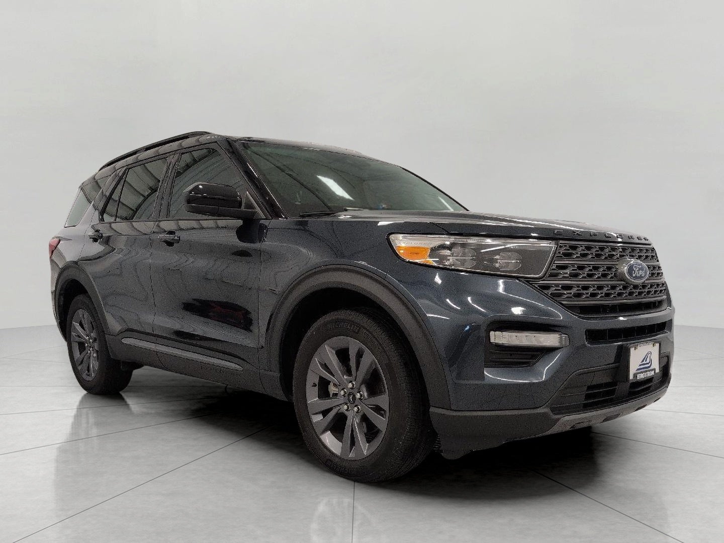 2024 Ford Explorer XLT 4WD in Stone Blue Metallic — front three-quarter view