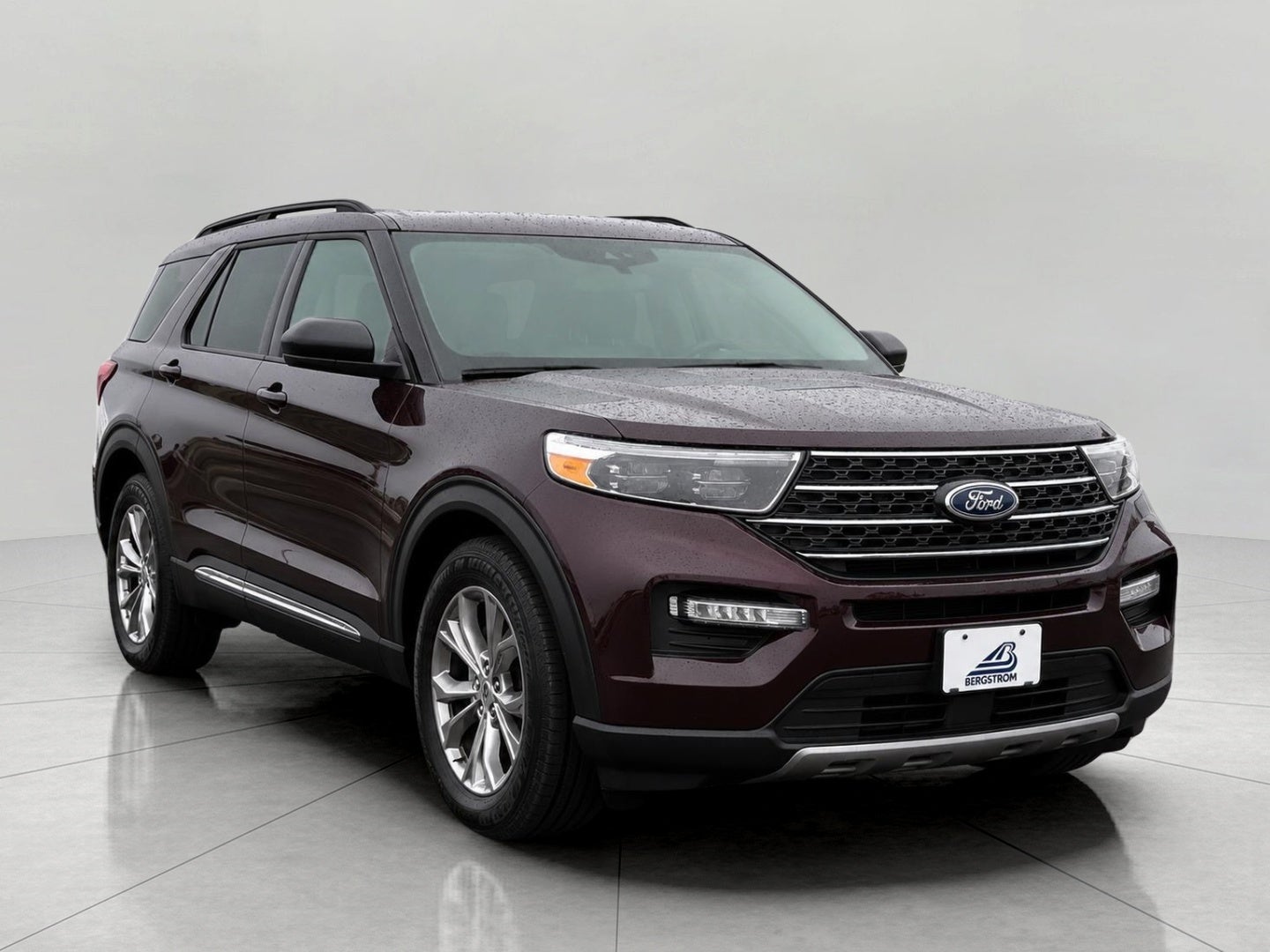 2023 Ford Explorer XLT 4WD in Jewel Red Metallic Tinted Clearcoat — front three-quarter view