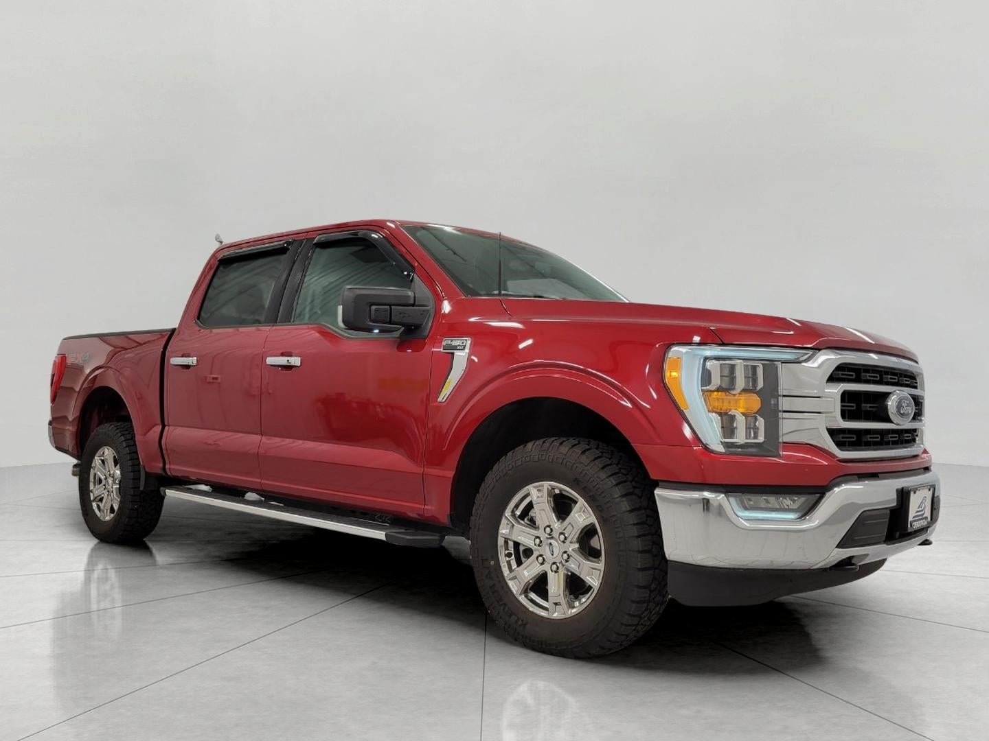 2022 Ford F-150 XLT 4WD SuperCrew 5.5' Box in Rapid Red Metallic Tinted Clearcoat — front three-quarter view