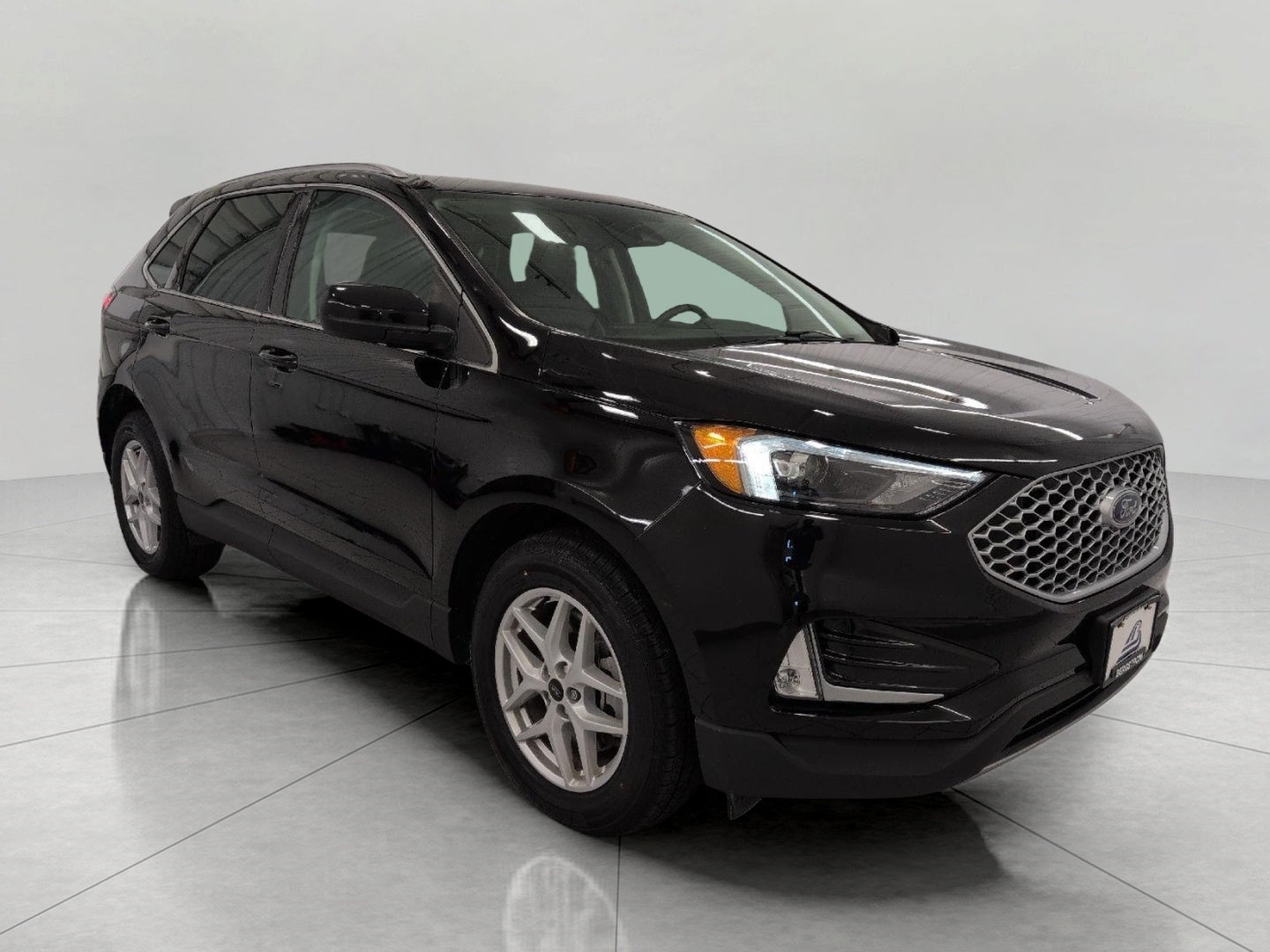 2024 Ford Edge SEL AWD in Agate Black Metallic — front three-quarter view